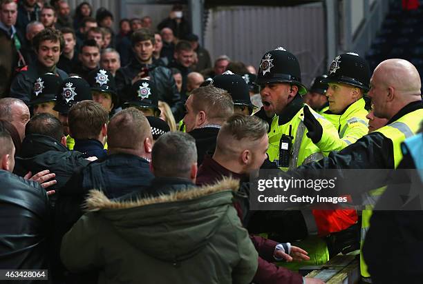 Fans clash with Police during the FA Cup fifth round match between Blackburn Rovers and Stoke City at Ewood park on February 14, 2015 in Blackburn,...