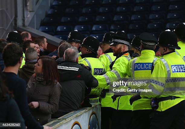 Fans clash with Police during the FA Cup fifth round match between Blackburn Rovers and Stoke City at Ewood park on February 14, 2015 in Blackburn,...