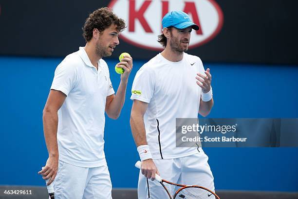 Robin Haase of the Netherlands and Christopher Kas of Germany talk tactics in their second round doubles match against Bob Bryan of the United States...