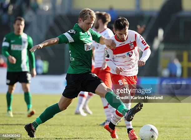 Okan Aydin of Erfurt is challenged by Kevin Schoeneberg of Muenster during the Third League match between FC Rot Weiss Erfurt and SC Preussen...