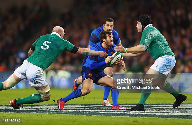 Camille Lopez of France is tackled by Paul O'Connell and Mike Ross of Ireland during the RBS Six Nations match between Ireland and France at Aviva...