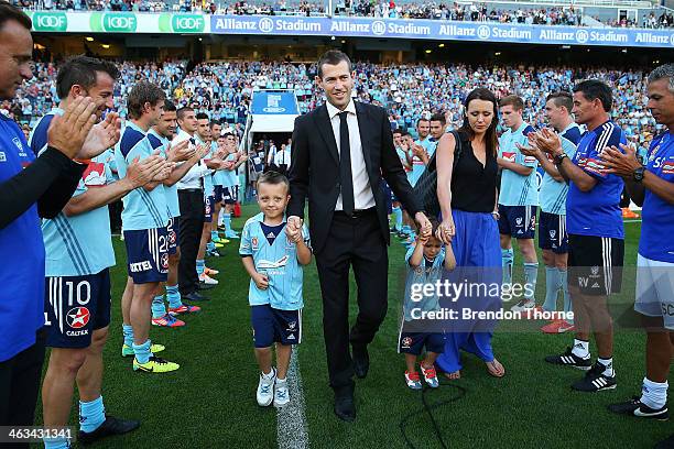 Brett Emerton of Sydney and his family receive a guard of honour from Sydney players and staff on his farewell lap prior to the round 15 A-League...