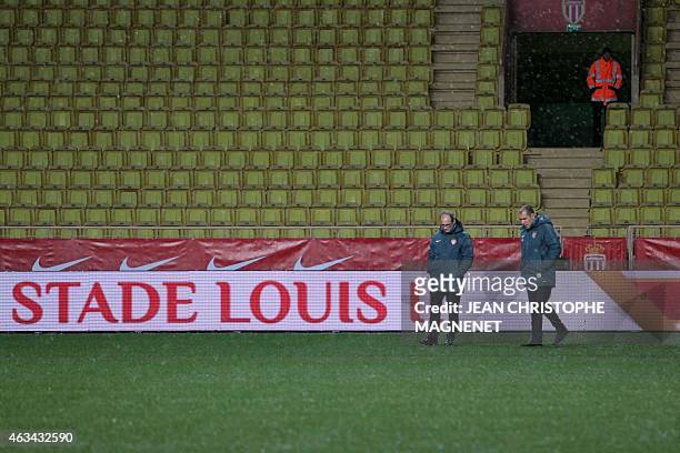 Monaco's Portuguese head coach Leonardo Jardim and Monaco's Portuguese technical director Luis Campos look at the pitch of the Louis II Stadium in...