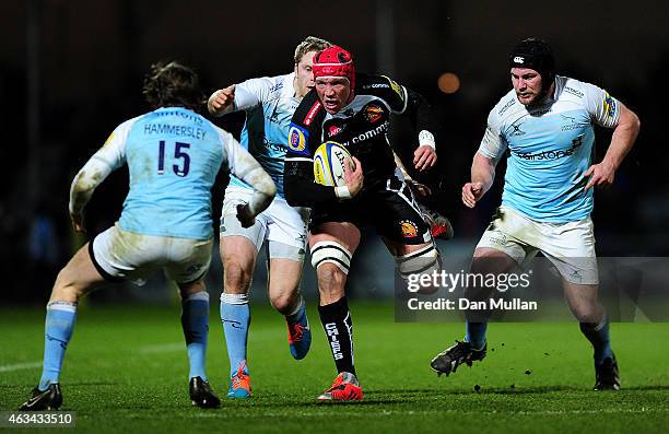 Tom Johnson of Exeter Chiefs takes on Simon Hammersley of Newcastle Falcons during the Aviva Premiership match between Exeter Chiefs and Newcastle...
