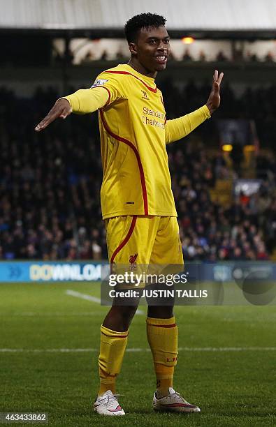 Liverpool's English striker Daniel Sturridge celebrates scoring an equalising goal during the English FA Cup fifth round football match between...