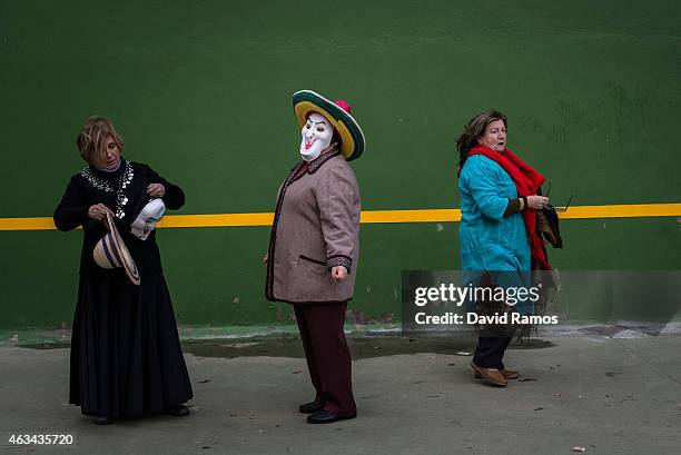 Women in fancy dress looks on as they join a carnival festival on February 14, 2015 in Luzon, Spain. Every year Luzon hosts one of the least-known...