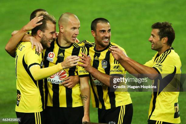 To R, Jeremy Brockie of the Phoenix celebrates his goal with teammates Stein Huysegems, Manny Muscat, and Vince Lia during the round 15 A-League...