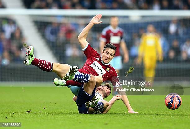 Stewart Downing of West Ham United is challenged by James Morrison of West Bromwich Albion during the FA Cup Fifth Round match between West Bromwich...