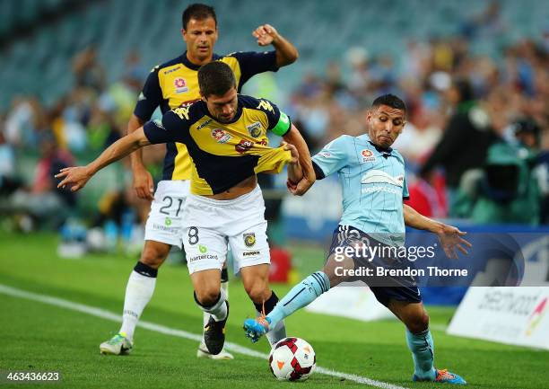 Ali Abbas of Sydney competes with Nick Montgomery of the Mariners during the round 15 A-League match between Sydney FC and the Central Coast Mariners...