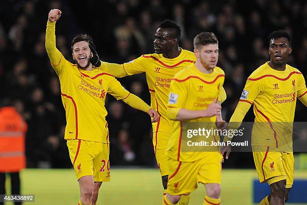 Adam Lallana of Liverpool celebrates with Mario Balotelli after scoring the second during the FA Cup Fifth Round match between Crystal Palace and...