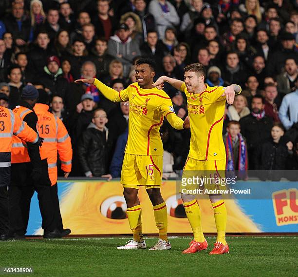 Daniel Sturridge and Alberto Moreno of Liverpool dance after scoring an equalising goal during the FA Cup Fifth Round match between Crystal Palace...