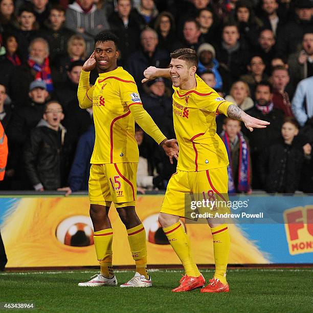 Daniel Sturridge and Alberto Moreno of Liverpool dance after scoring an equalising goal during the FA Cup Fifth Round match between Crystal Palace...