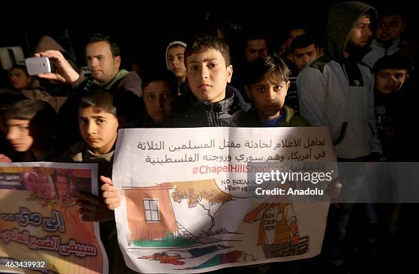 Group of Palestinians protest against the Chapel Hill shooting, in Jabalia region in Gaza City, Gaza on February 14, 2015. Three young Muslim...