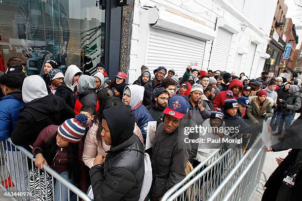 Fans await the arrival of NBA player Russell Westbrook outside of the True Religion Brooklyn Flagship store on February 14, 2015 in Brooklyn.