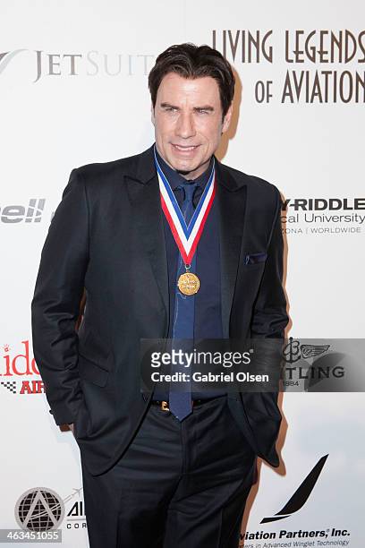 John Travolta arrives for the 11th Annual Living Legends Of Aviation Awards at The Beverly Hilton Hotel on January 17, 2014 in Beverly Hills,...