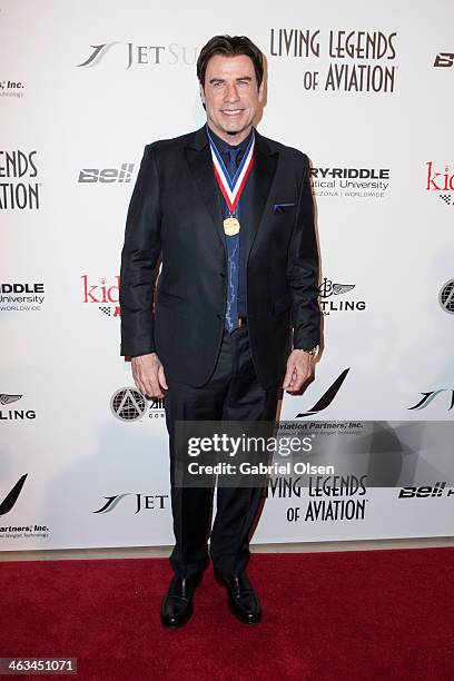 John Travolta arrives for the 11th Annual Living Legends Of Aviation Awards at The Beverly Hilton Hotel on January 17, 2014 in Beverly Hills,...