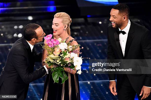 Carlo Conti, Margot Robbie and Will Smith attend the closing night of 65th Festival di Sanremo 2015 at Teatro Ariston on February 14, 2015 in...