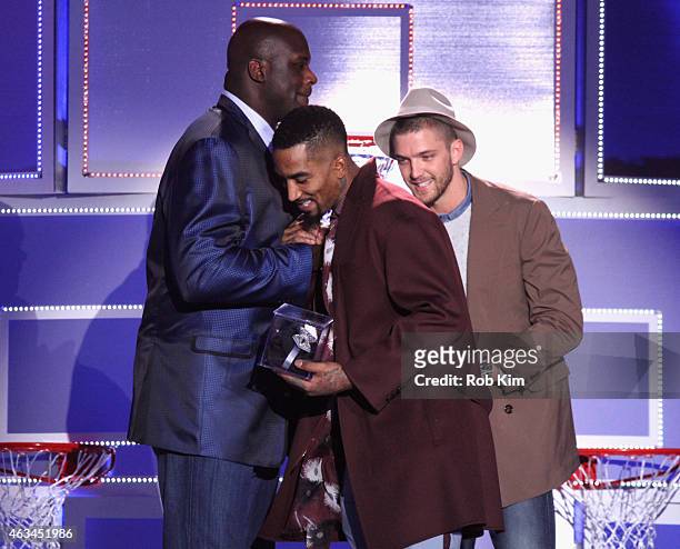 Shaquille O'Neal congratulates winner J. R. Smith as Chandler Parsons looks on during The NBA All-Star All-Style presented by Samsung Galaxy, the...