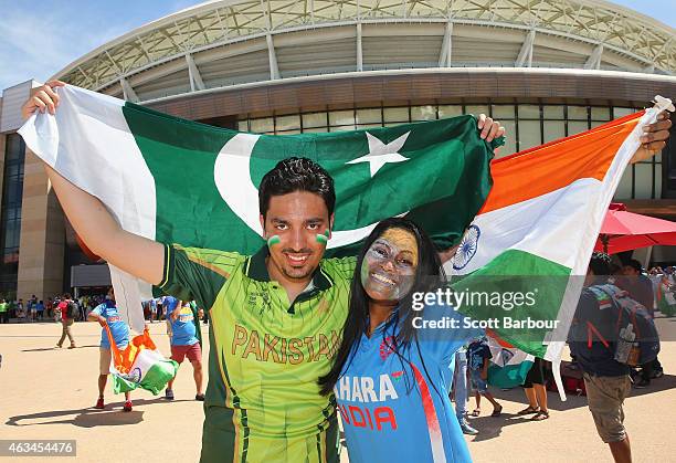 Pakistan and India supporters pose with their flags outside of the ground during the 2015 ICC Cricket World Cup match between India and Pakistan at...