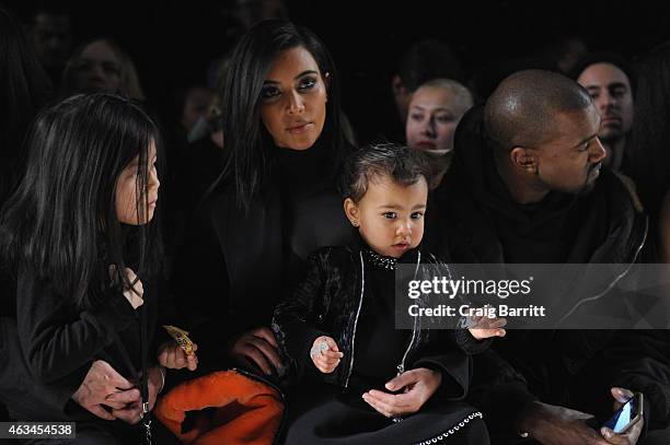 Alia Wang, Kim Kardashian, North West and Kanye West attend the Alexander Wang Fashion Show during Mercedes-Benz Fashion Week Fall 2015 at Pier 94 on...