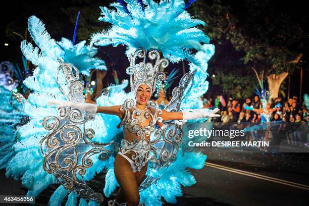 Dancers parade in the street during carnival in Santa Cruz, on the Spanish Canary island of Tenerife on February 14, 2015. The over-month-long event...