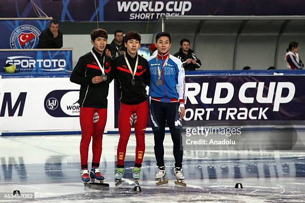Gold medalist Tianyu Han of China , Silver medalist Chen Dequan of China and Victor An of Russia pose for a picture after winning the Men's 1500m A...