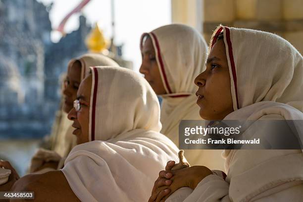 Group of Jain nuns is meditating in a temple at Shatrunjaya hill, one of the major pilgrim sites for Jains, on the opening day of the yatra season.