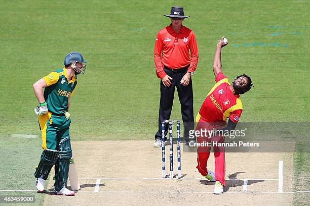 Solomon Mire of Zimbabwe bowls during the 2015 ICC Cricket World Cup match between South Africa and Zimbabwe at Seddon Park on February 15, 2015 in...