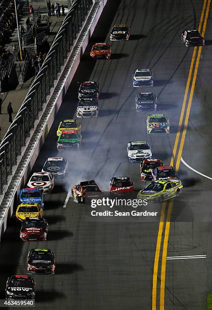 Jamie McMurray, driver of the McDonald's Chevrolet, and Paul Menard, driver of the Peak/Menard's Chevrolet, spin out in an on track incident during...