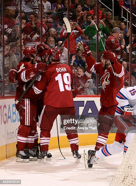Center Antoine Vermette of the Arizona Coyotes celebrates his second period goal with right wing Shane Doan during the NHL game against the New York...