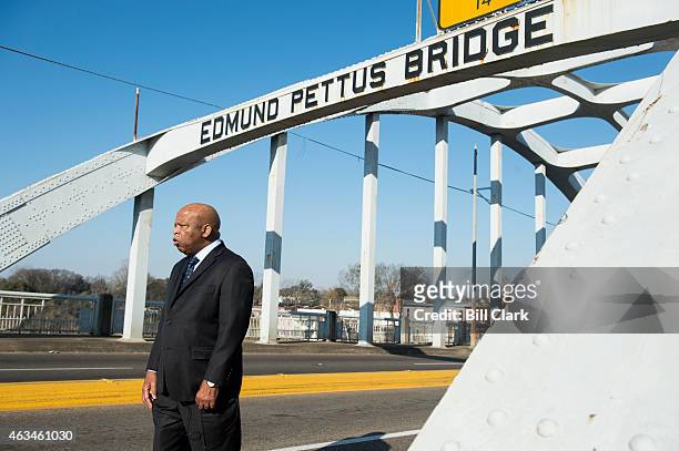 Rep. John Lewis, D-Ga., stands on the Edmund Pettus Bridge in Selma, Ala., in between television interviews on Feb. 14, 2015. Rep. Lewis was beaten...
