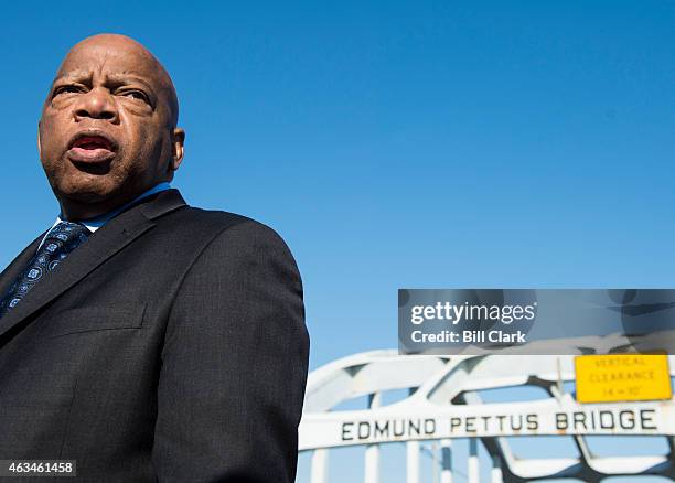 Rep. John Lewis, D-Ga., stands on the Edmund Pettus Bridge in Selma, Ala., in between television interviews on Feb. 14, 2015. Rep. Lewis was beaten...