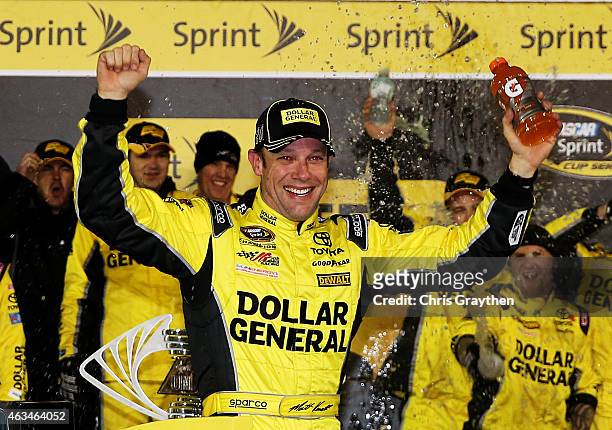 Matt Kenseth, driver of the Dollar General Toyota, celebrates in victory lane after winning the 3rd Annual Sprint Unlimited at Daytona at Daytona...