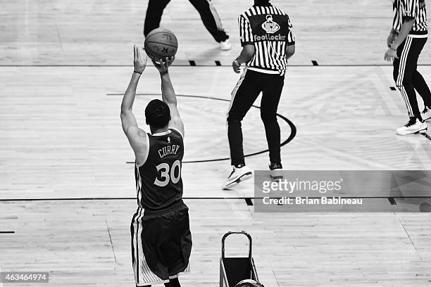 Stephen Curry of the Golden State Warrors shoots a three pointer during the Footlocker Three-Point Contest on State Farm All-Star Saturday Night as...