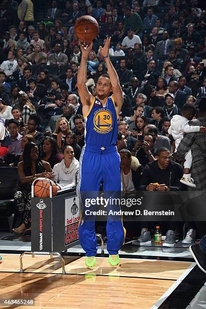 Stephen Curry of the Golden State Warriors shoots the ball during the Foot Locker Three Point Contest on State Farm All-Star Saturday Night as part...