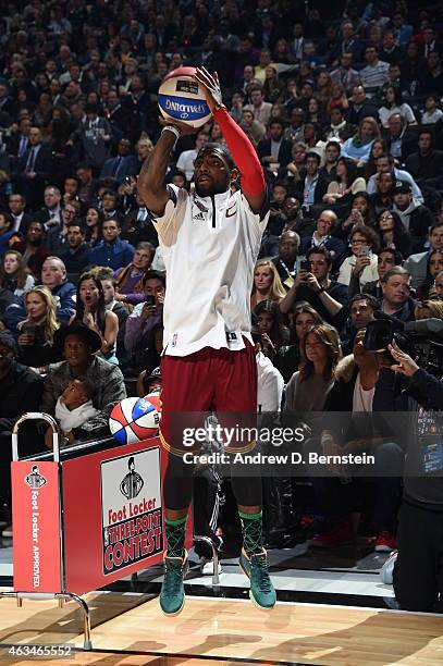 Kyrie Irving of the Clevland Cavaliers shoots the ball during the Foot Locker Three Point Contest on State Farm All-Star Saturday Night as part of...