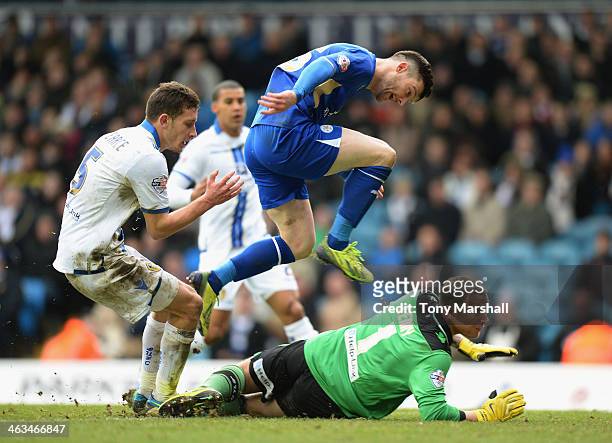David Nugent of Leicester City jumps over Paddy Kenny of Leeds United as he scores their first goal during the Sky Bet Championship match between...