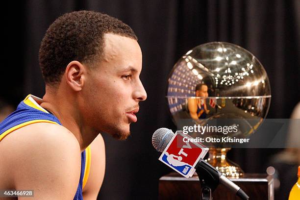 Stephen Curry of the Golden State Warriors talks with the media after winning the Foot Locker Three Point Contest on State Farm All-Star Saturday...