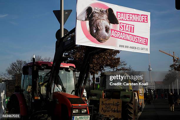 Banner is fixed on a tractor at a rally on January 18, 2014 in Berlin, Germany. Several thousand demonstrators attended the march in protest against...