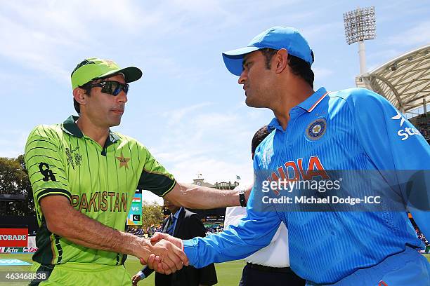 Dhoni of India and Shahid Afridi of Pakistan shake hands after the toss during the 2015 ICC Cricket World Cup match between India and Pakistan at...