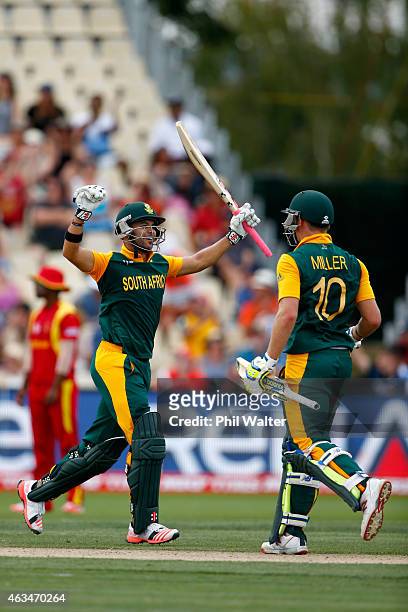 Duminy of South Africa celebrates his century during the 2015 ICC Cricket World Cup match between South Africa and Zimbabwe at Seddon Park on...
