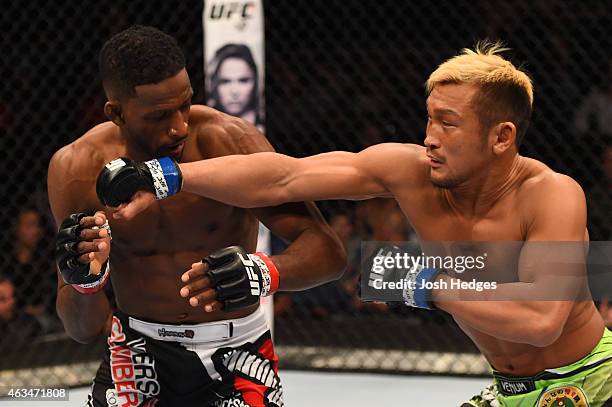 Kiichi Kunimoto punches Neil Magny in their welterweight fight during the UFC Fight Night event inside 1stBank Center on February 14, 2015 in...