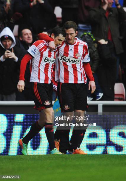 Adam Johnson of Sunderland celebrates with Craig Gardner as he scores their second goal during the Barclays Premier League match between Sunderland...