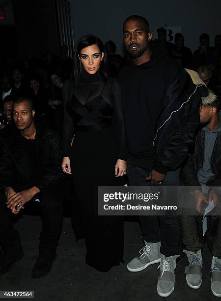 Kim Kardashian and Kanye West attend the Robert Geller fashion show during Mercedes-Benz Fashion Week Fall 2015 at Pier 59 on February 14, 2015 in...