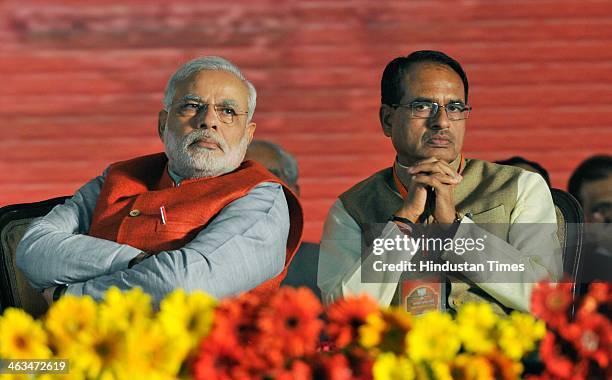 Prime ministerial candidate Narendra Modi and Madhya Pradesh Chief Minister Shivraj Singh Chauhan at the BJP National Executive Meeting at Ramleela...