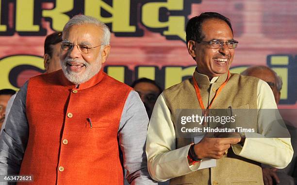 Prime ministerial candidate Narendra Modi and Madhya Pradesh Chief Minister Shivraj Singh Chauhan at the BJP National Executive Meeting at Ramleela...