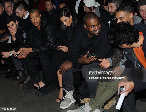 Kim Kardashian and Kanye West attend the Robert Geller fashion show during Mercedes-Benz Fashion Week Fall 2015 at Pier 59 on February 14, 2015 in...