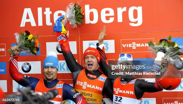 Albert Demchenko of Russia second placed, Felix Loch of Germany winner, and Andi Langenhan of Germany , third placed, jubilate during the flower...