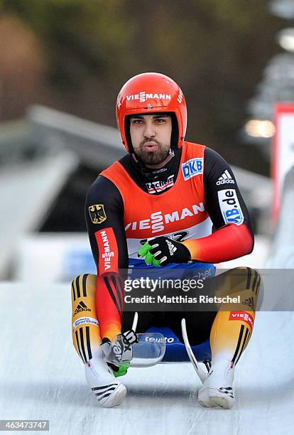 Third placed Andi Langenhan of Germany reacts after crossing the finish line during the FIL Viessmann Luge World Cup Men event at the DKB Eiskanal...