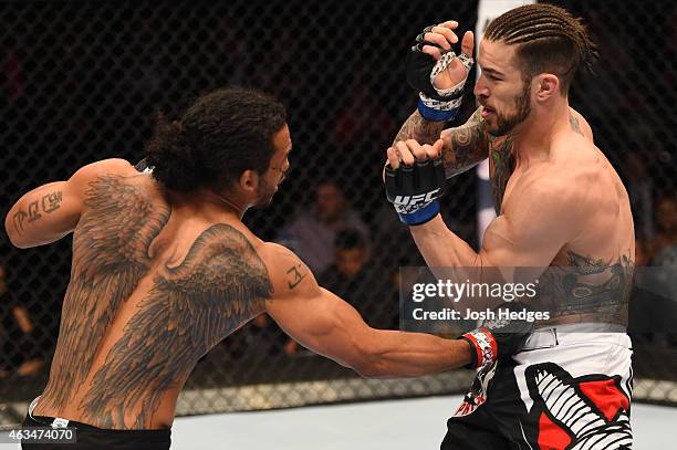 Benson Henderson lands a punch to the body of Brandon Thatch in their welterweight fight during the UFC Fight Night event inside 1stBank Center on...